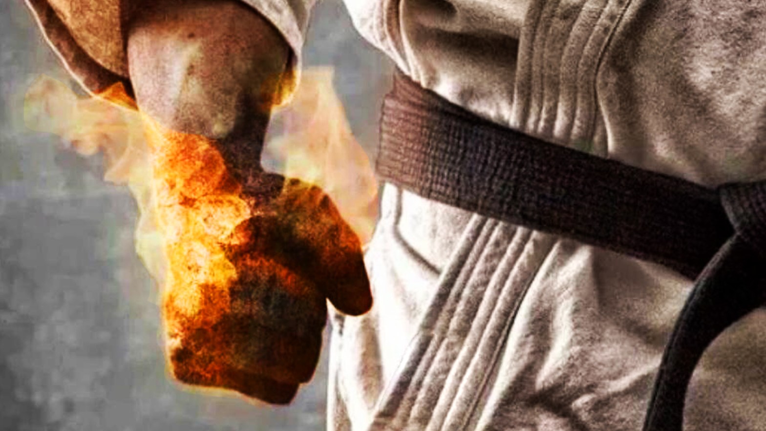 Foto 1 Cortesía: Google Images, Hombre vistiendo un karate gi con cinturón negro empuña la mano envuelta en fuego.